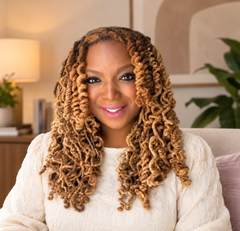 Portrait of Erica D. Woods, LPC, seated in a warmly lit office